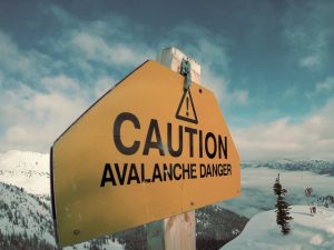 caution avalanche danger signage during winter